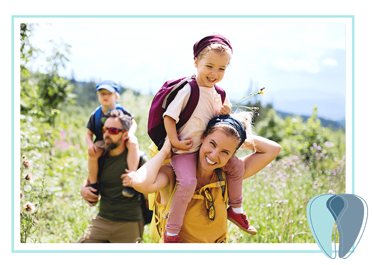 Family happily hiking mountains Young family hiking flowery mountains