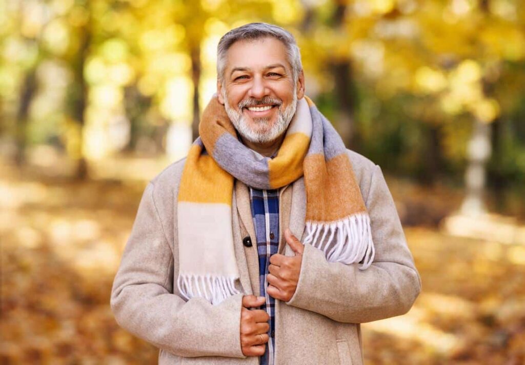Man-outside-smiling-autumn Happy man enjoying nature smile